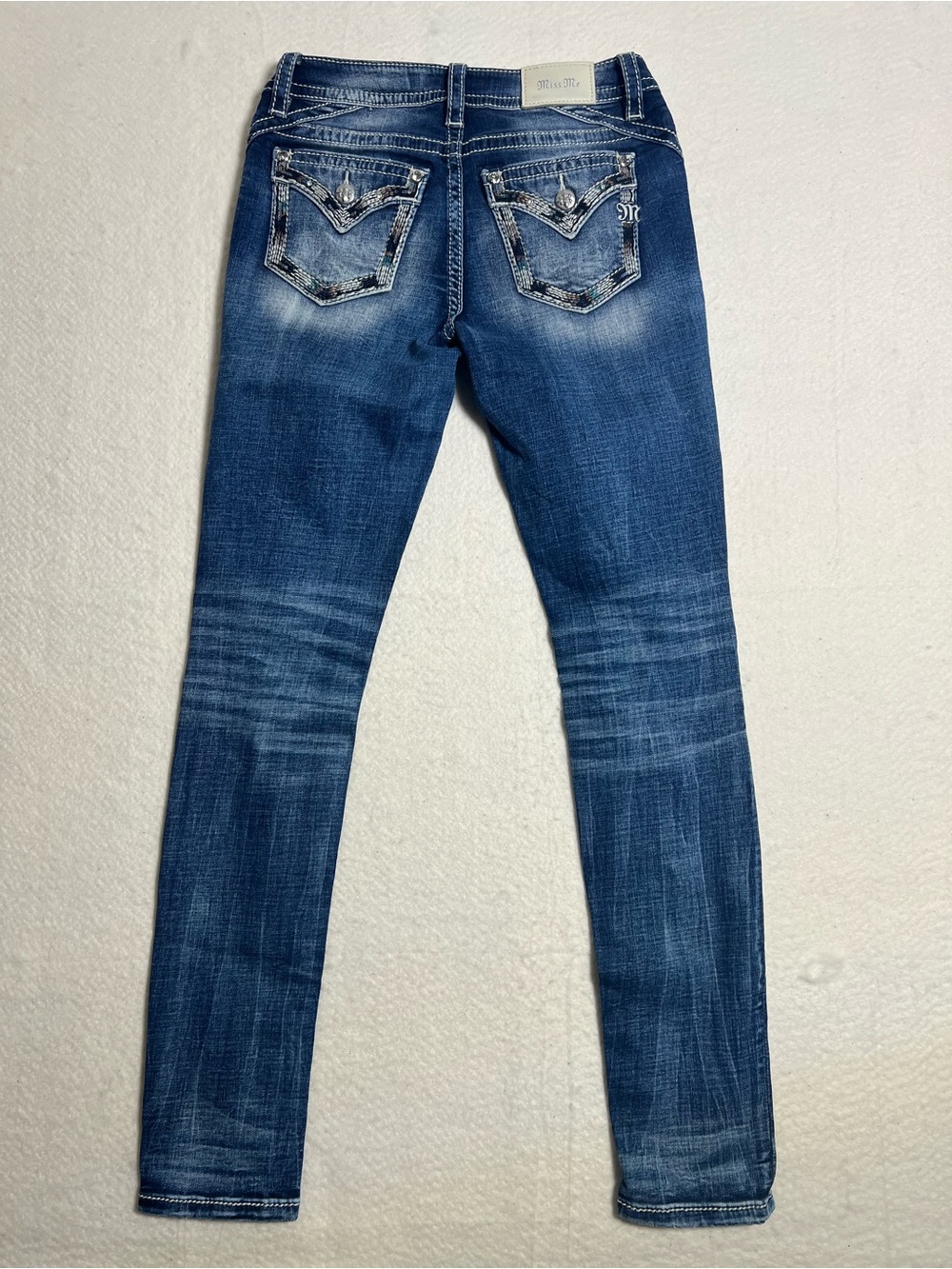 Distressed Mid-Blue Women’s Skinny Jeans
